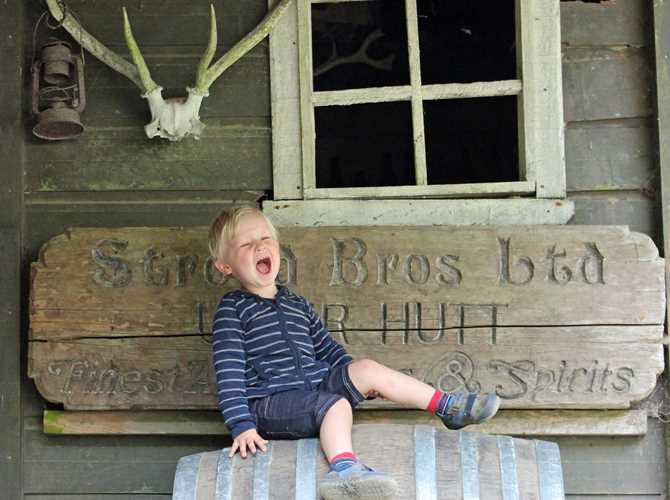 Settlement kid Staglands Wildlife Reserve | kid sitting on an old barrel